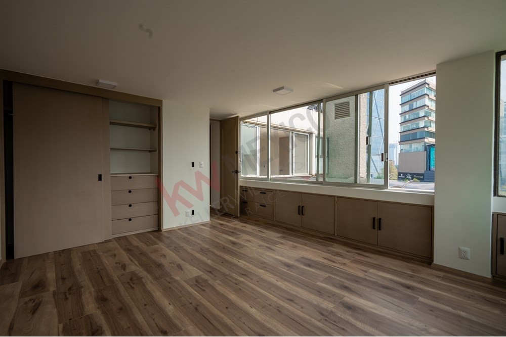 150 Viaducto Rio Becerra, Unit PH Alton Bay, CDMX 03810 - Photo 21 of 33 wooden floor in an empty room with a window