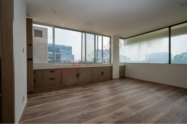 a view of an empty room with a window