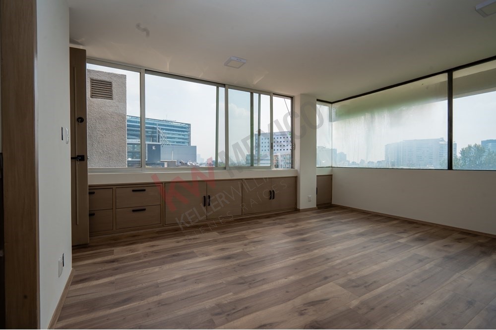 150 Viaducto Rio Becerra, Unit PH Alton Bay, CDMX 03810 - Photo 23 of 33 a view of an empty room with a window