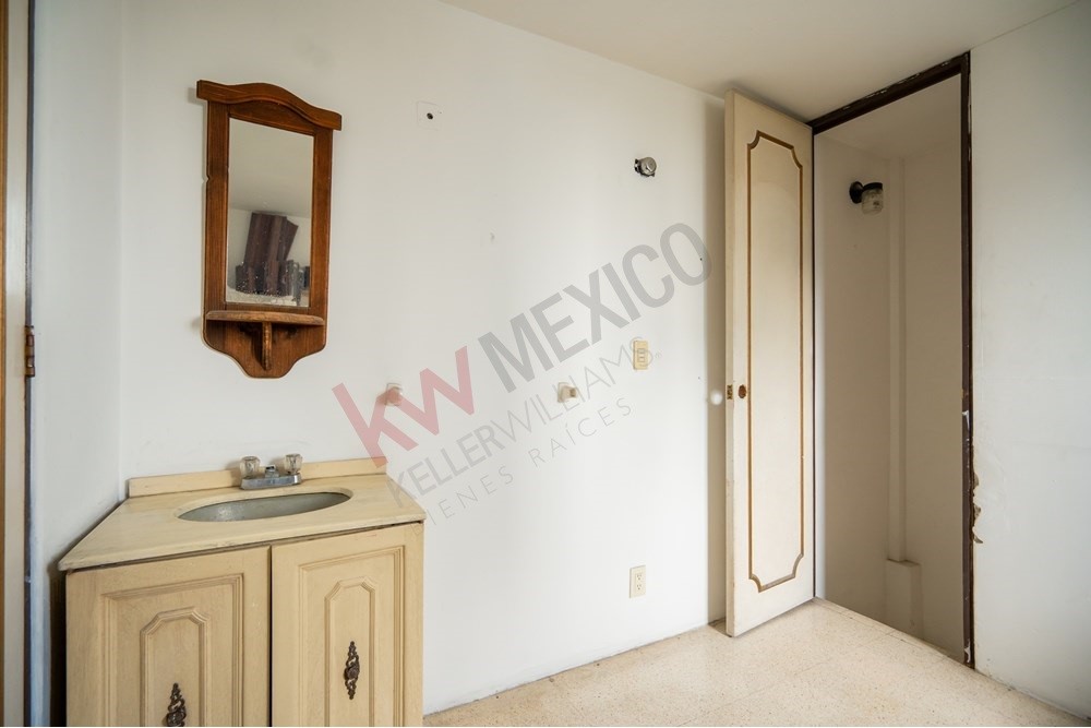 150 Viaducto Rio Becerra, Unit PH Alton Bay, CDMX 03810 - Photo 24 of 33 a bathroom with a granite countertop shower a mirror and vanity