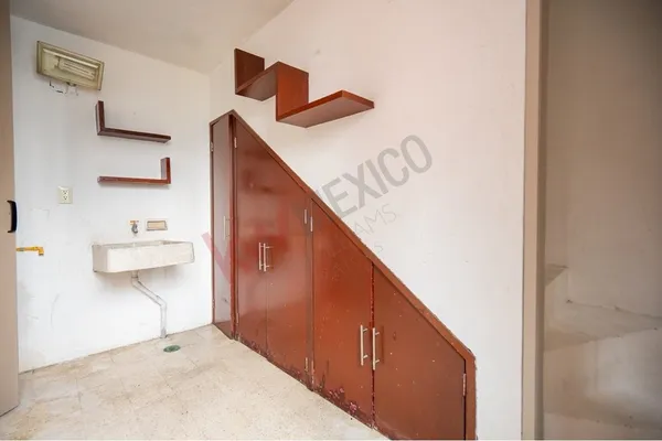 a view of a hallway with seating area