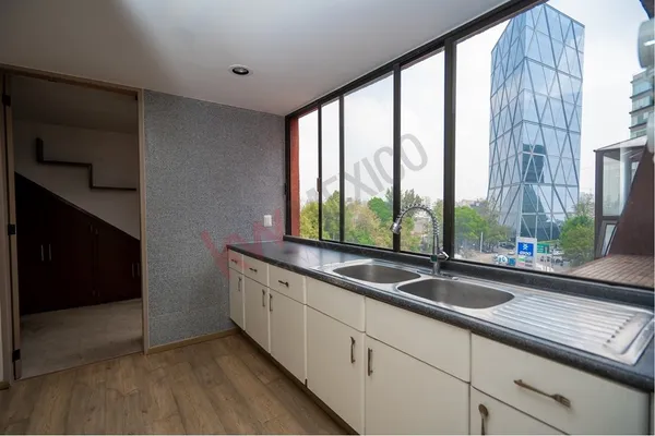 a view of a sink and a window in a room