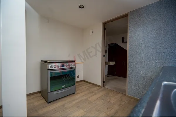 a view of an empty room with a fireplace