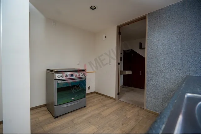 a view of an empty room with a fireplace