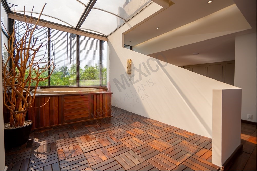 150 Viaducto Rio Becerra, Unit PH Alton Bay, CDMX 03810 - Photo 3 of 33 a view of a porch with wooden floor and furniture