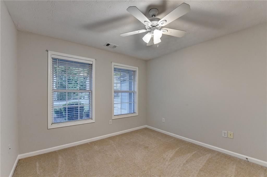 310 Andrew Ridge Drive Jefferson, GA 30549 - Photo 45 of 52 an empty room with windows and fan