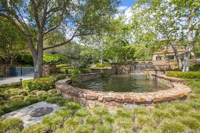 a view of swimming pool with outdoor seating