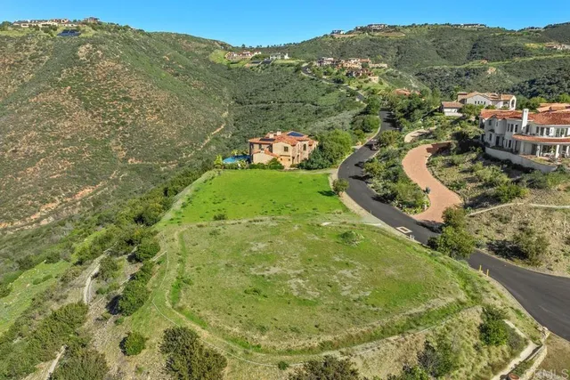 a view of a field with an ocean view