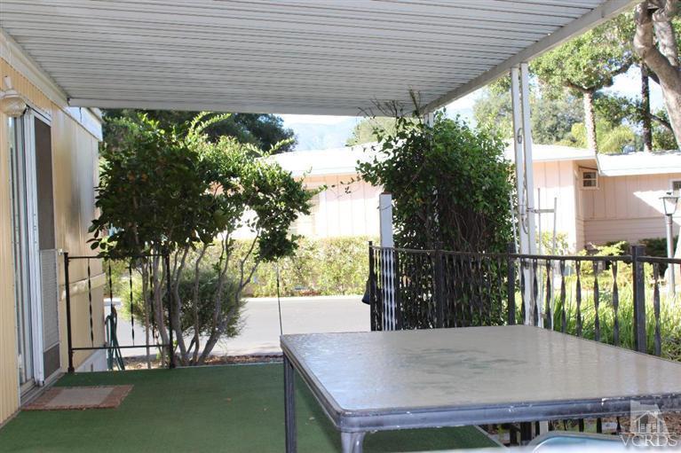 1225 South Rice Road, Unit 35 Ojai, CA 93023 - Photo 3 of 19 a view of a porch with furniture and a yard