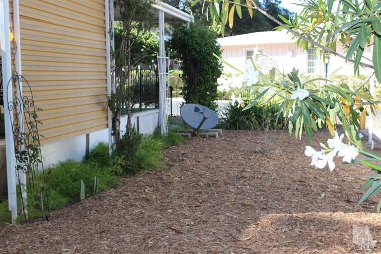 1225 South Rice Road, Unit 35 Ojai, CA 93023 - Photo 5 of 19 a backyard of a house with lots of green space
