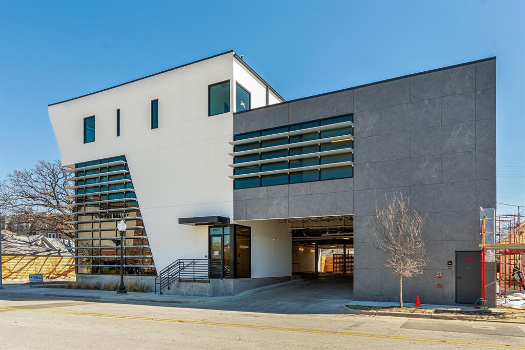 a view of a living room and entryway door