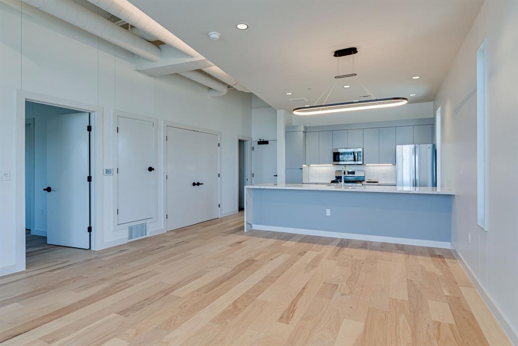 1023 Lipscomb Street, Unit 302 Fort Worth, TX 76104 - Photo 11 of 30 a view of kitchen with wooden floor