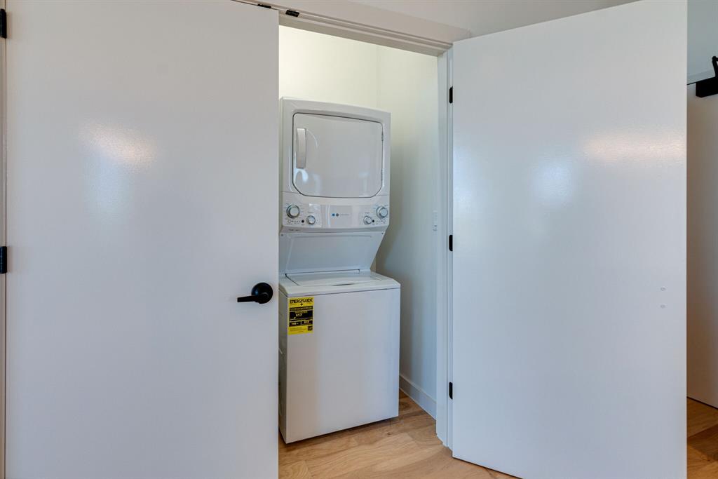 1023 Lipscomb Street, Unit 302 Fort Worth, TX 76104 - Photo 17 of 30 a utility room with a washer and dryer