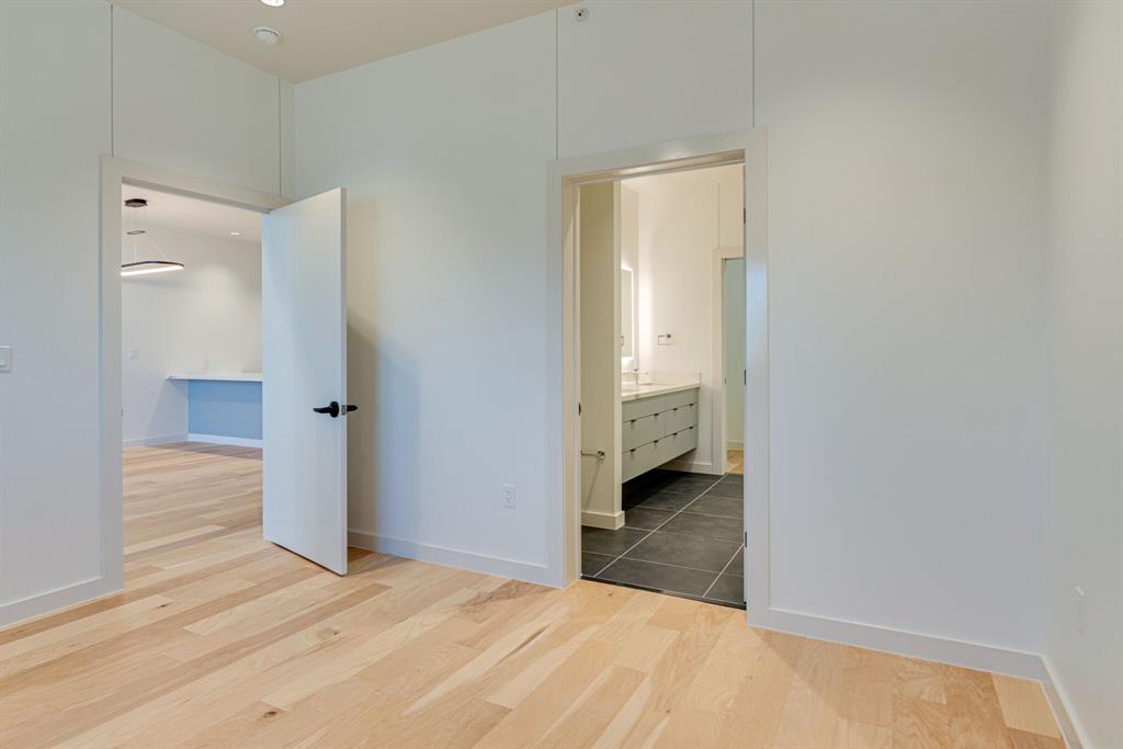 1023 Lipscomb Street, Unit 302 Fort Worth, TX 76104 - Photo 27 of 30 a view of a room with an empty space and a hallway