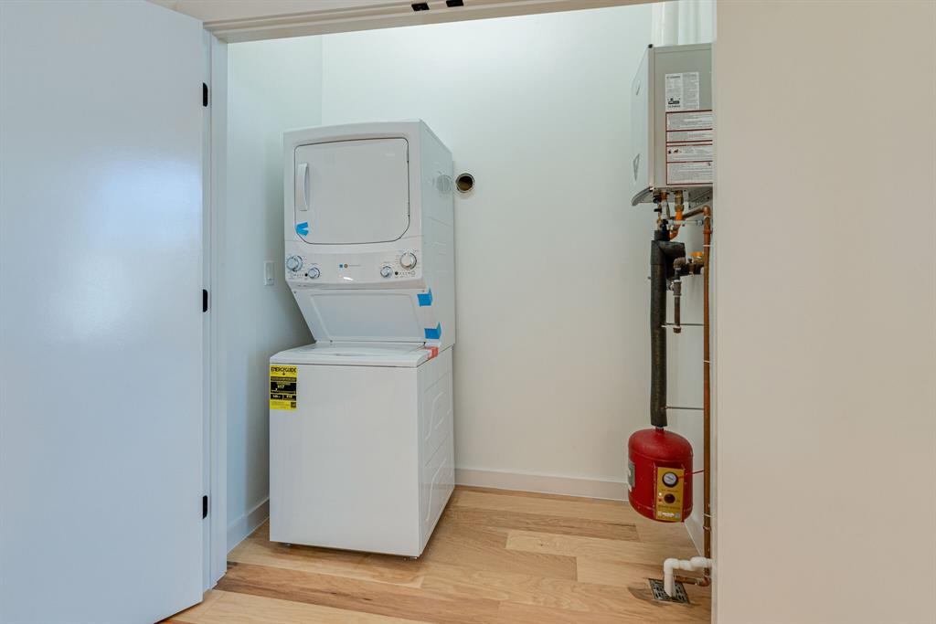 1023 Lipscomb Street, Unit 302 Fort Worth, TX 76104 - Photo 29 of 30 a utility room with dryer and washer