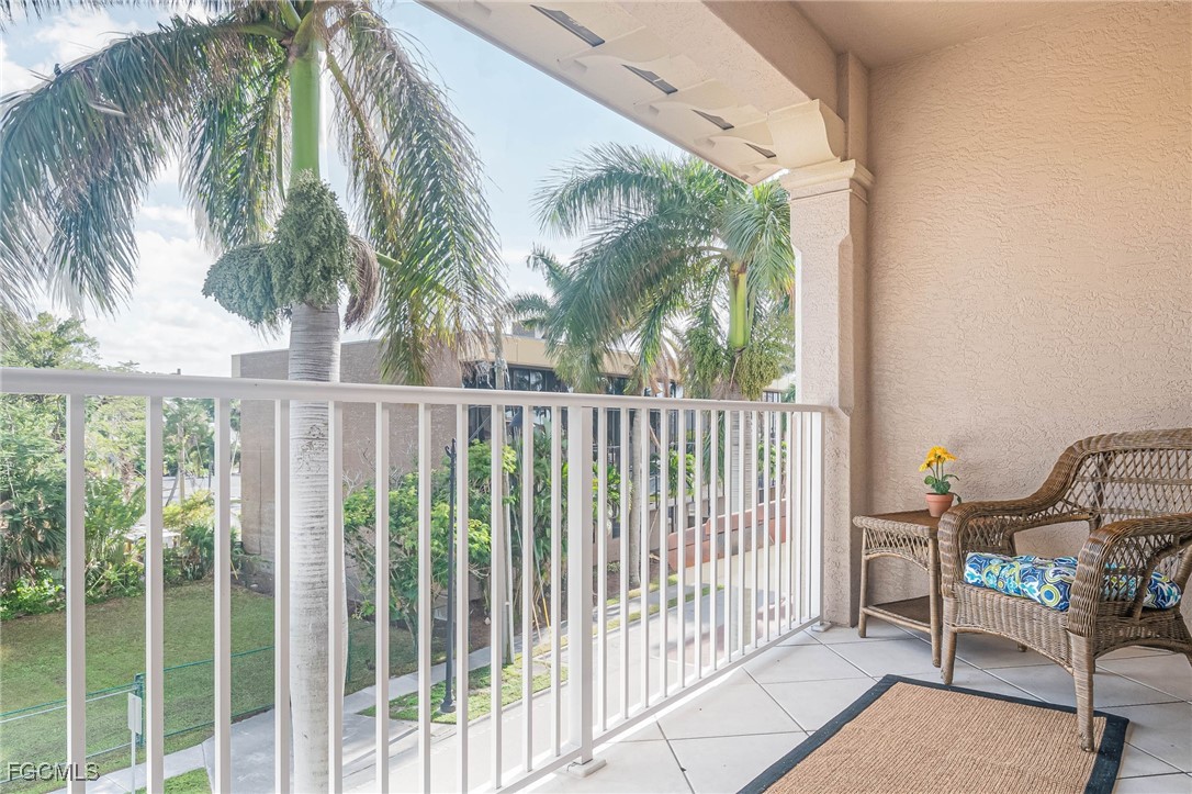 2080 West First Street, Unit 206 Fort Myers, FL 33901 - Photo 20 of 33 a view of a chair and table in the balcony