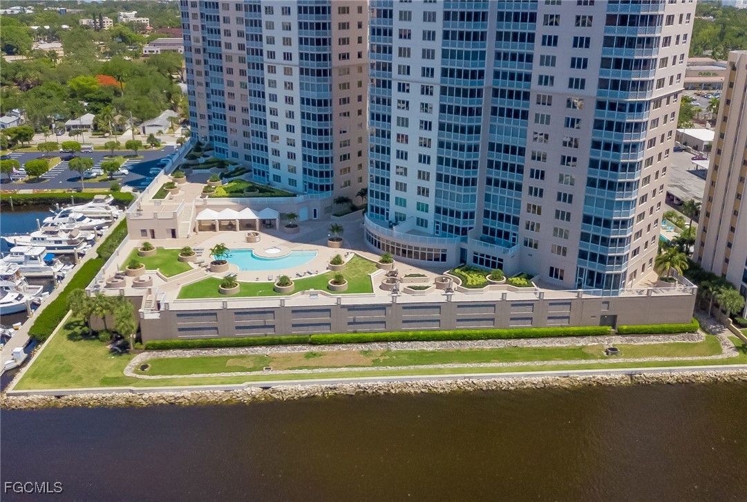 2080 West First Street, Unit 206 Fort Myers, FL 33901 - Photo 22 of 33 a view of a swimming pool with a building in the background