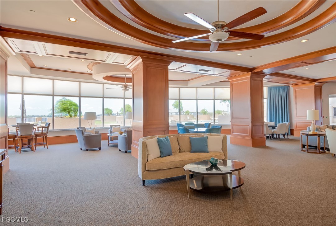 2080 West First Street, Unit 206 Fort Myers, FL 33901 - Photo 25 of 33 a living room with furniture and floor to ceiling windows