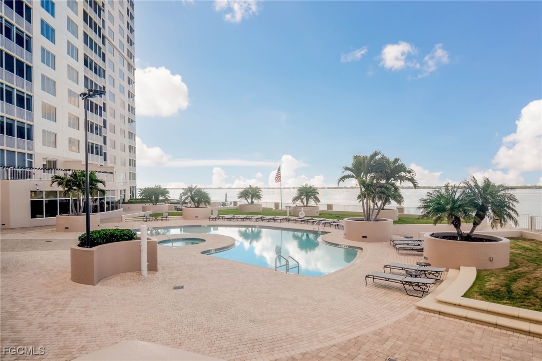 2080 West First Street, Unit 206 Fort Myers, FL 33901 - Photo 30 of 33 a view of a swimming pool and a patio