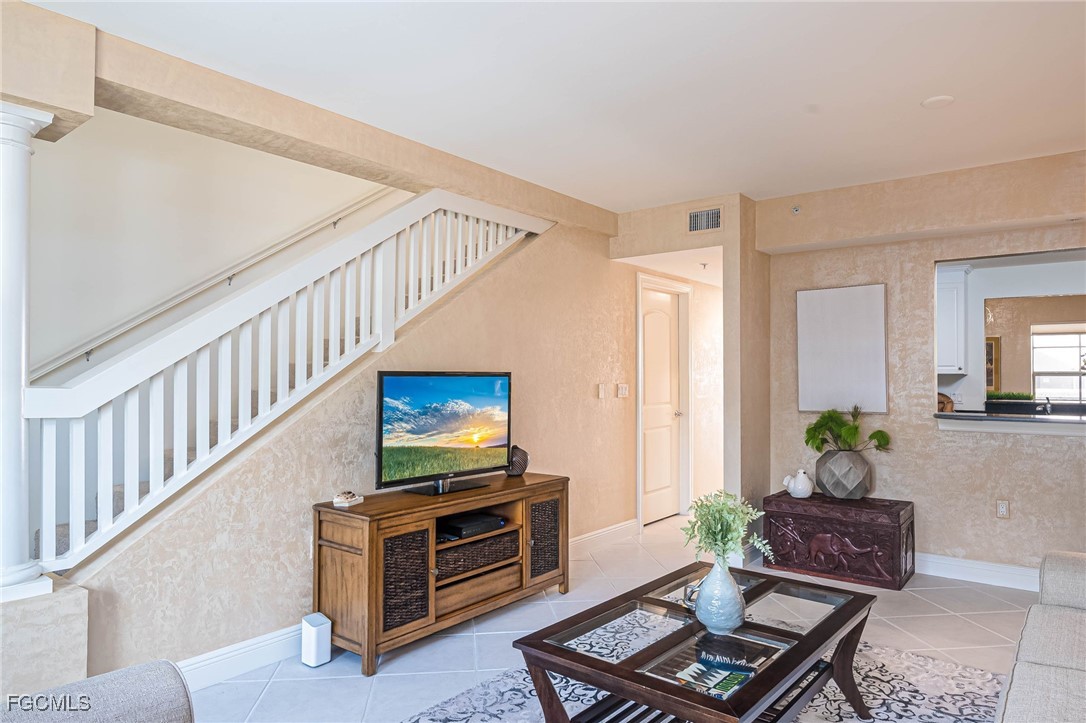 2080 West First Street, Unit 206 Fort Myers, FL 33901 - Photo 4 of 33 a living room with furniture and a flat screen tv