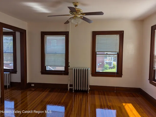 a view of a room with rack and wooden floor