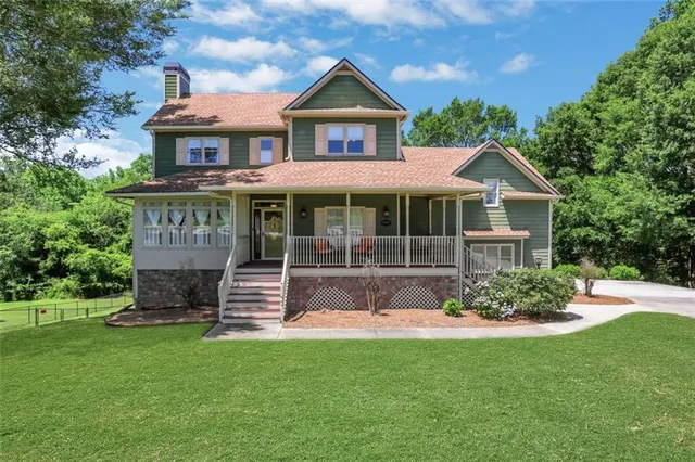 a front view of a house with a yard