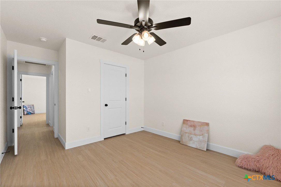 2115 Blackhawk Loop Belton, TX 76513 - Photo 20 of 26 a view of livingroom with hardwood floor and ceiling fan
