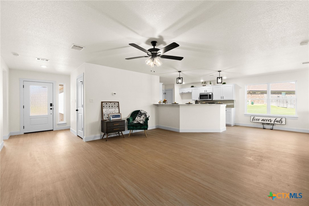2115 Blackhawk Loop Belton, TX 76513 - Photo 5 of 26 a living room with furniture and a fireplace