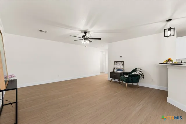 a view of workspace with wooden floor