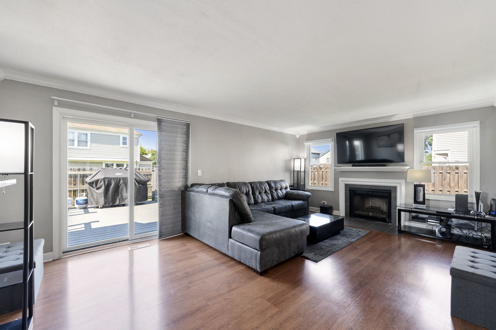 24 Fillmore Lane Streamwood, IL 60107 - Photo 13 of 35 a living room with furniture a fireplace and a flat screen tv
