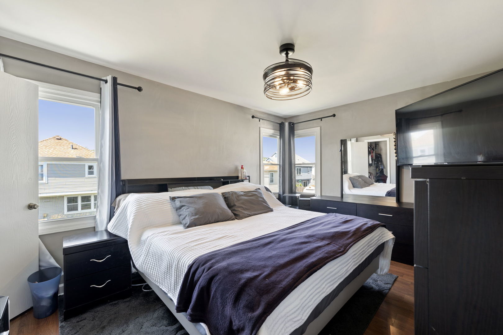 24 Fillmore Lane Streamwood, IL 60107 - Photo 17 of 35 a bedroom with a bed and a tv on the dresser