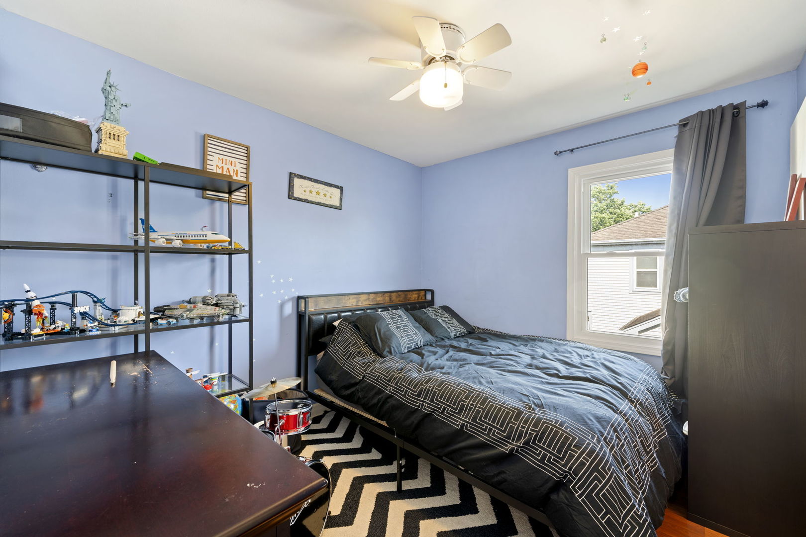 24 Fillmore Lane Streamwood, IL 60107 - Photo 20 of 35 a bed sitting in a bedroom next to a window