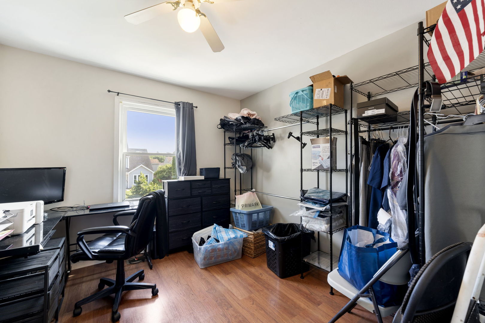 24 Fillmore Lane Streamwood, IL 60107 - Photo 22 of 35 a view of a workspace with furniture and a window