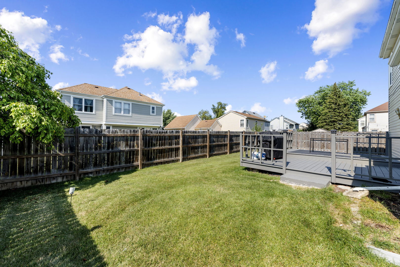 24 Fillmore Lane Streamwood, IL 60107 - Photo 27 of 35 a view of a house with a yard and sitting area