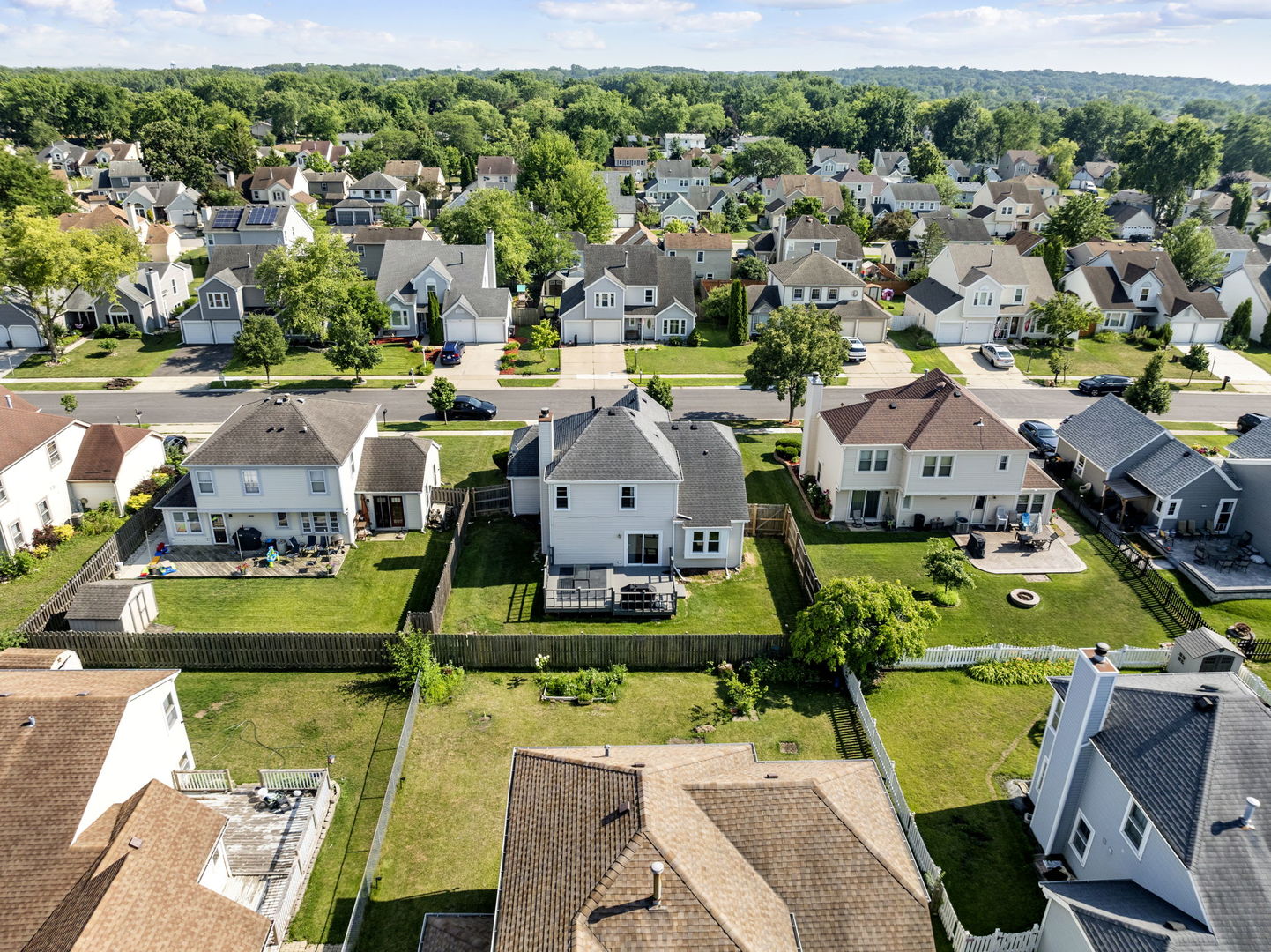 24 Fillmore Lane Streamwood, IL 60107 - Photo 32 of 35 an aerial view of a house with a swimming pool outdoor seating and yard