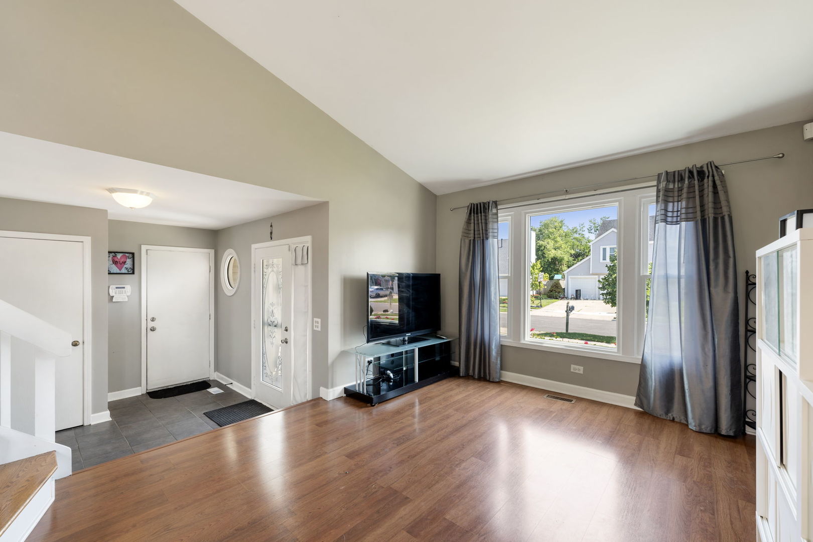 24 Fillmore Lane Streamwood, IL 60107 - Photo 6 of 35 a view of a livingroom with wooden floor and furniture