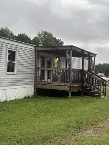 a view of a large room with lots of trees