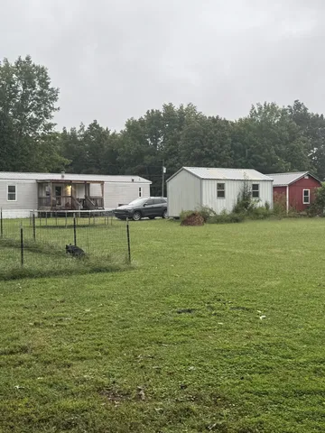 a view of a lake with houses in the back
