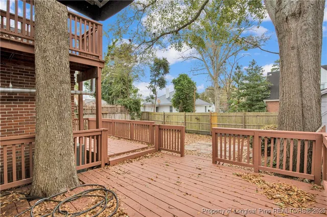 a view of a wooden chairs on a deck