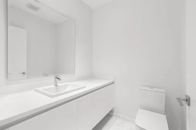 a bathroom with a sink and a toilet