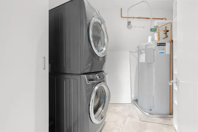 a view of a garden with buildings in the background