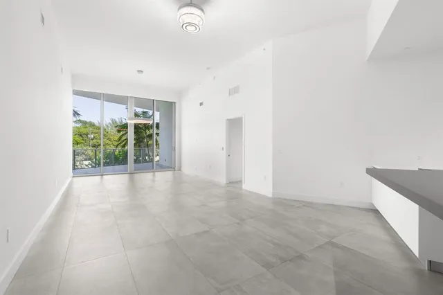 a view of dining room with furniture and window