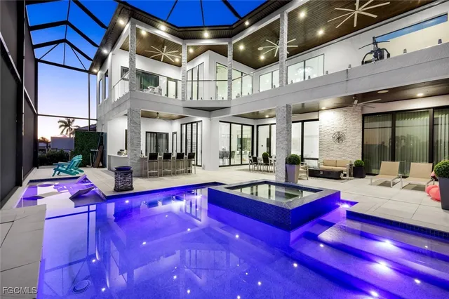 a living room with patio pool table and chairs