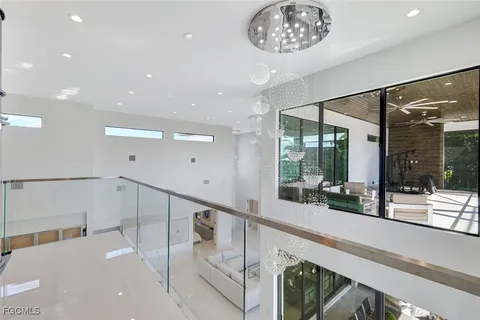 a hallway with a large mirror and a large mirror