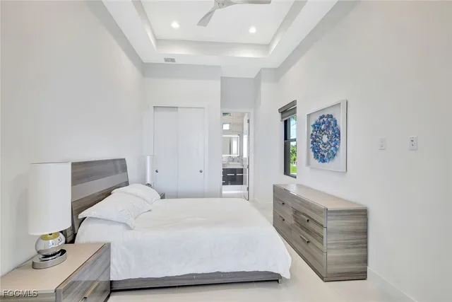 a bedroom with a bed and a couch