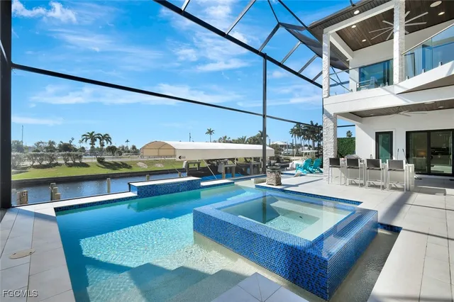 a view of a patio with swimming pool table and chairs