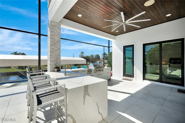 a lobby with furniture and large windows