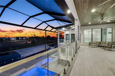 a view of a chairs and tables in the patio