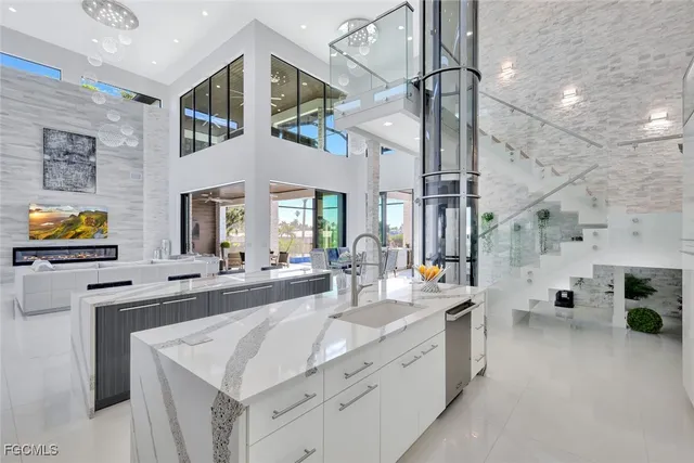 a kitchen with stainless steel appliances a sink stove and cabinets