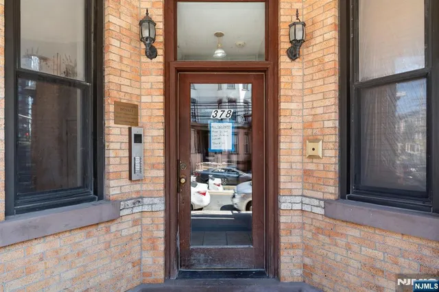 a front view of a house with a glass door